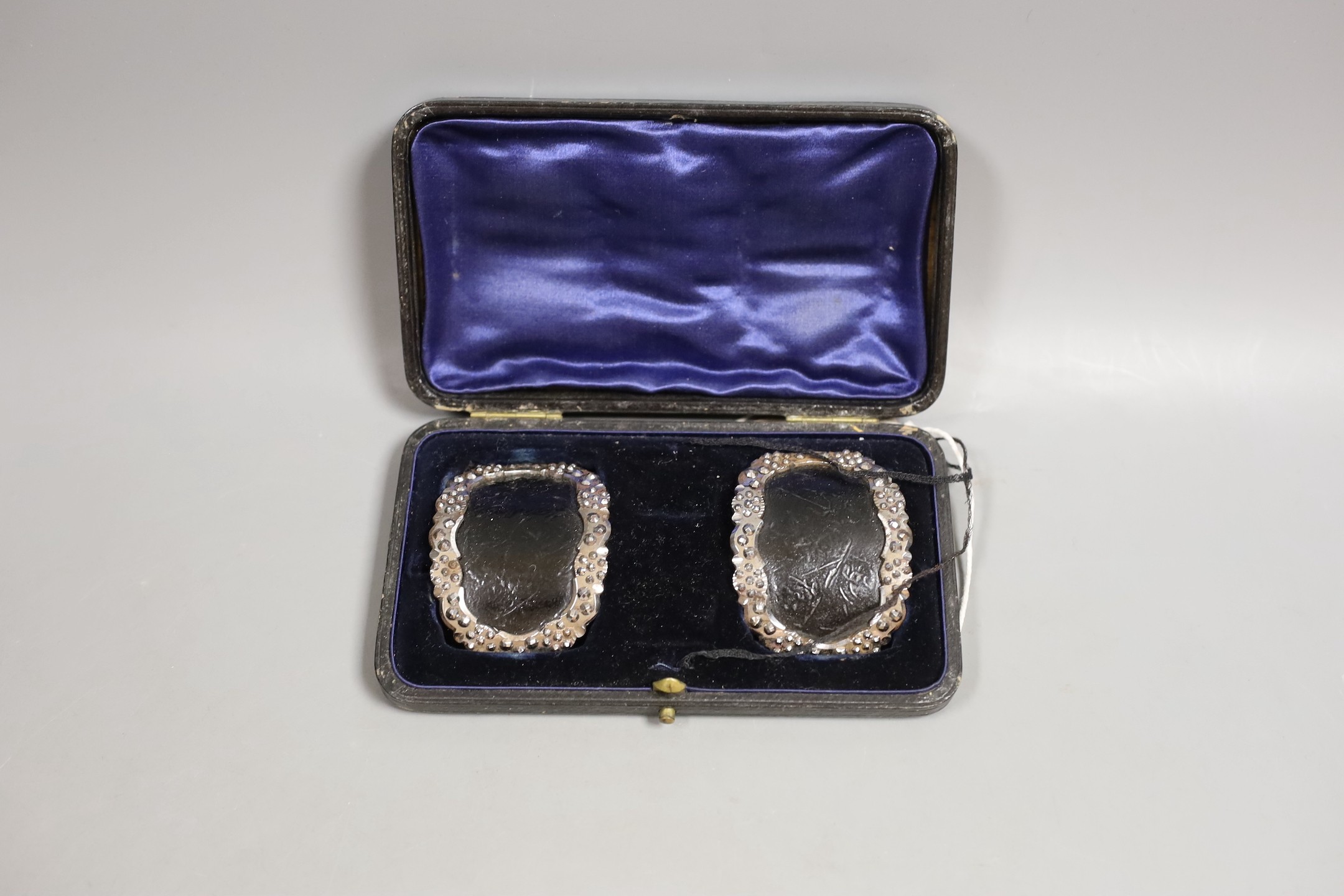 A cased pair of Georgian cut steel buckles